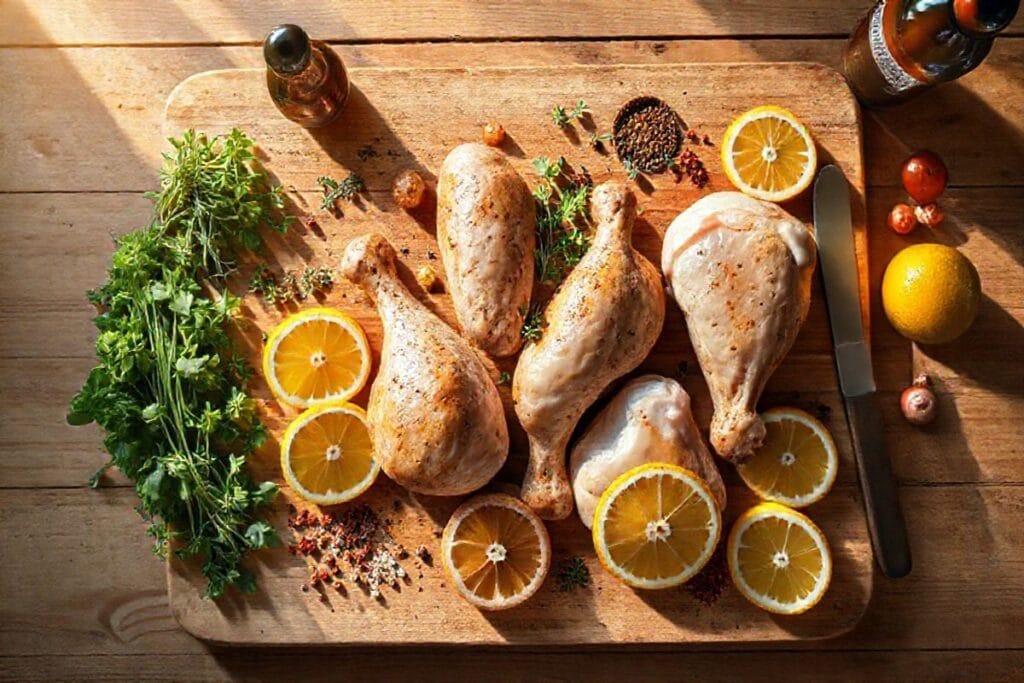 How to Make Smoked Chicken Drumsticks: Your Easy 4-Step Ultimate BBQ Guide 3 A beautifully arranged cutting board with fresh herbs, citrus, and spices for smoked chicken drumsticks